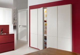 Built-in vertical storage units to give more
space in the kitchen.
